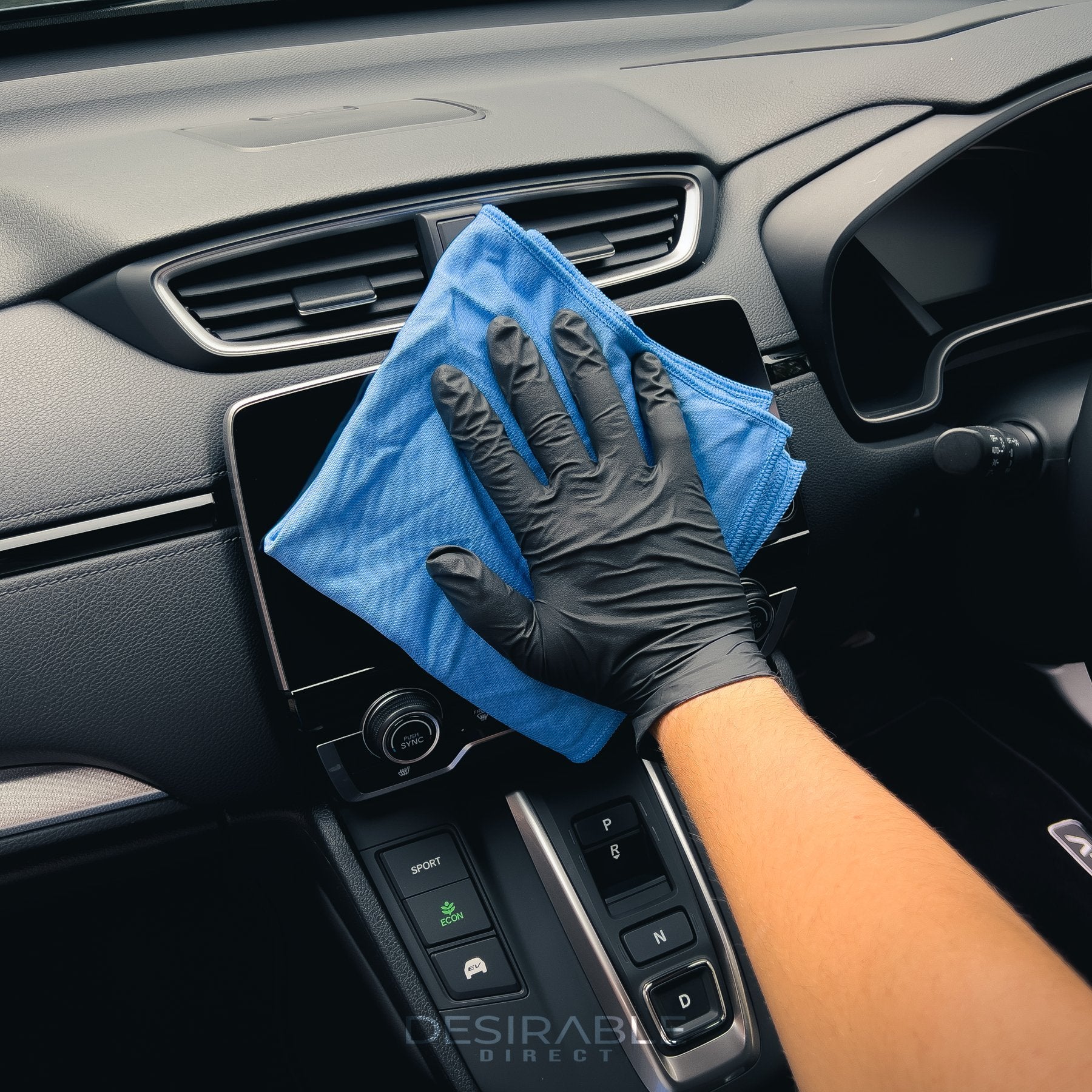 Car care microfibre blue glass cloth 40x40cm cleaning the interior entertainment screen in a car.