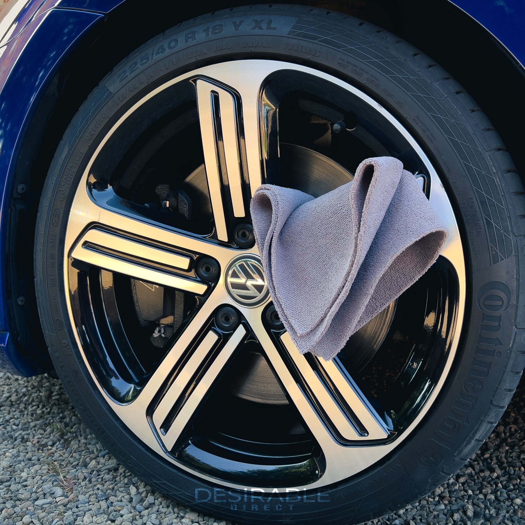 Car care microfibre grey cloth 40x40cm hanging from a silver alloy of a blue volkswagen golf r.