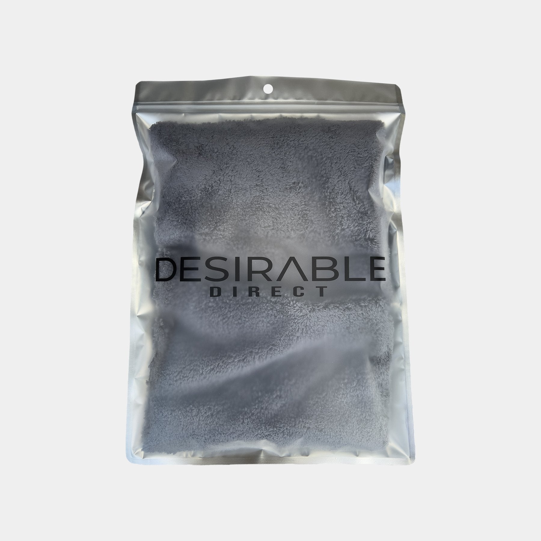 Car care plush grey microfibre cloth displayed on a white background in silver packaging with desirable direct printed on the front to keep the item clean when not in use.