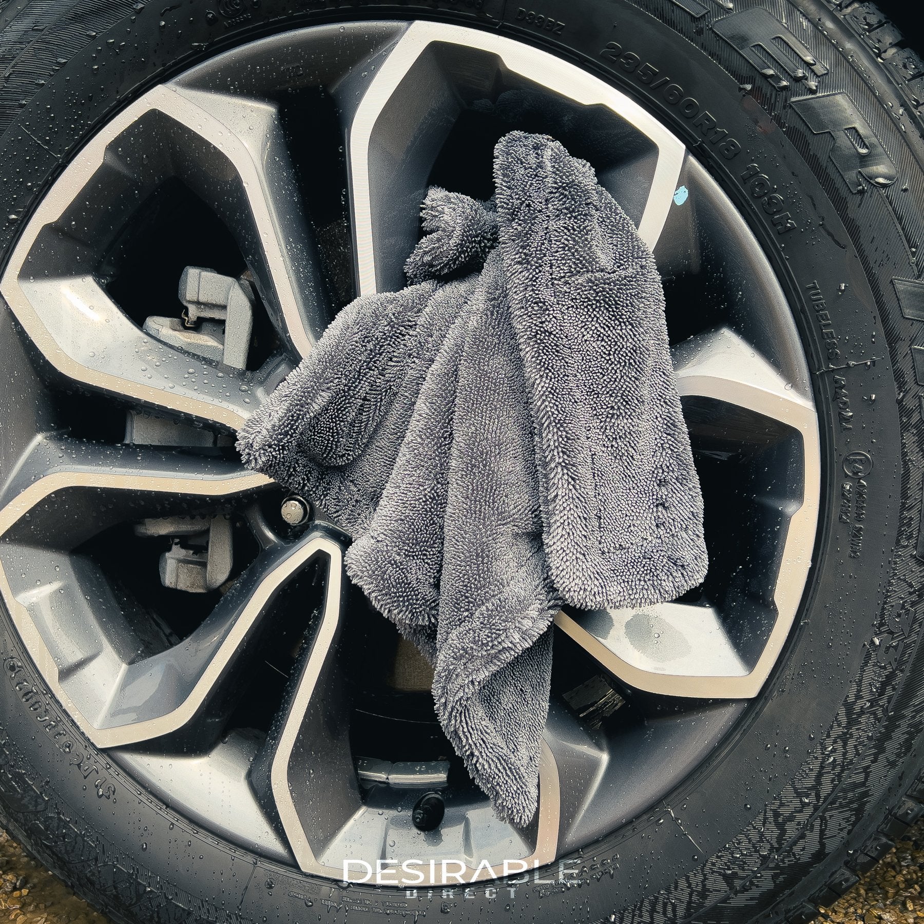 Car care small twisted pile grey microfibre wheel and trim 40x40cm drying towel displayed on a silver alloy.